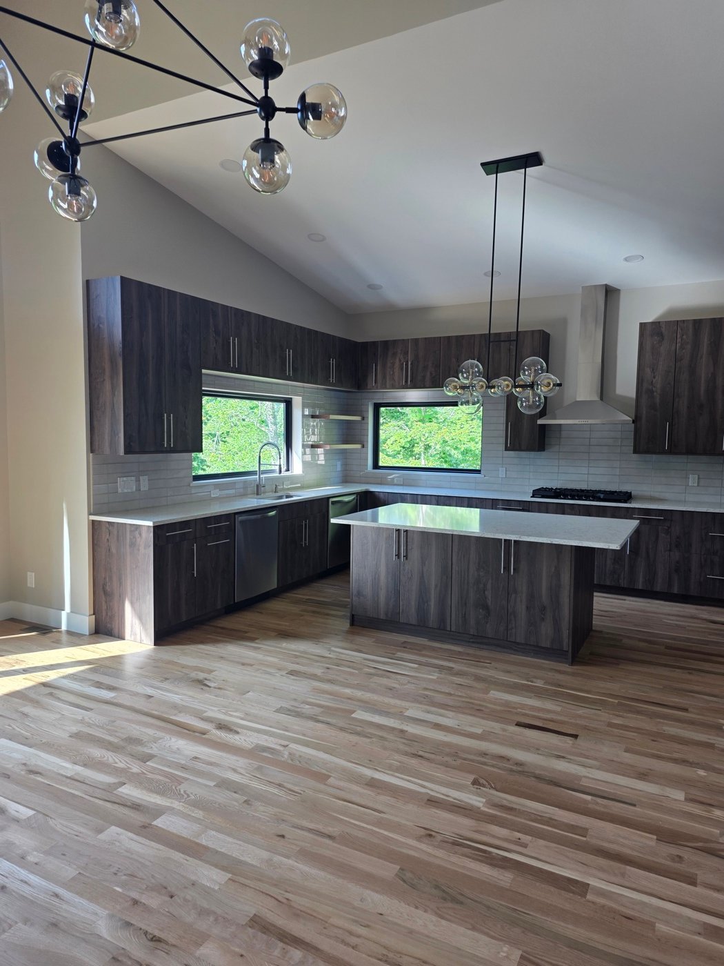 Kitchen cabinet installation with crown trim and finish detail