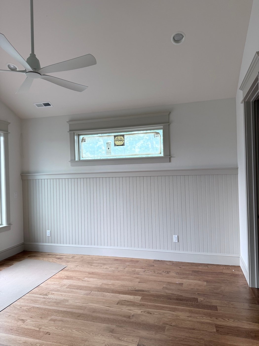 Crown molding and baseboard trim installed in a Western North Carolina living room